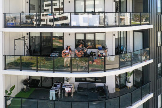 The Penrith duo Demage on their apartment balcony in Thornton, where they performed live for neighbors. 