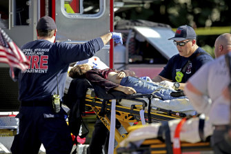 Medical personnel tend to a victim following a shooting at Marjory Stoneman Douglas High School in Parkland, Florida, in February last year.