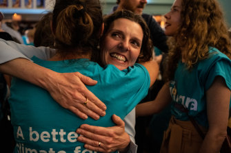 The new independent MP for Wentworth, Allegra Spender, hugging a supporter on election night. 
