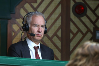 John McEnroe working as a tennis commentator for the BBC.