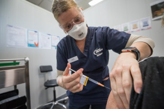 A nurse administers a COVID vaccine in Bendigo.