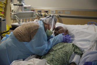 Romelia Navarro, 64, weeps while embracing her husband Antonio, in his final moments at the COVID unit in St Jude Medical Centre, Fullerton, California. More than 800,000 Americans have died from coronavirus infections since January 2020. 