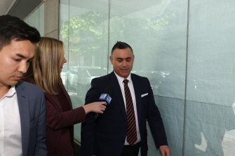 Former NSW deputy premier John Barilaro, centre, outside the ICAC during the lunch break on Monday.
