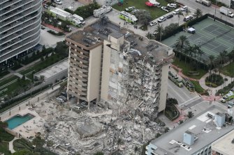 An aerial photo shows part of the 12-storey oceanfront apartment building that collapsed. 