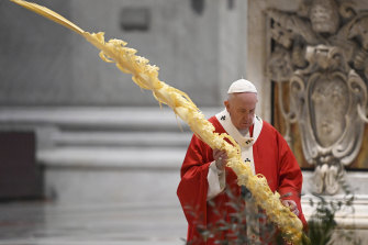 Pope Francis celebrates Palm Sunday Mass inside St Peter's Basilica. 