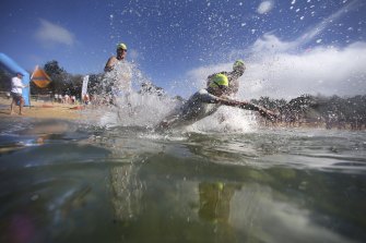 Swimmers take the plunge at last year’s ocean swim event at Malabar.