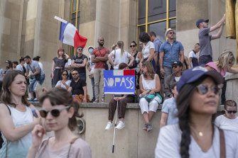 People attend a demonstration in Paris against the COVID-19 pass which grants vaccinated individuals greater ease of access to venues.