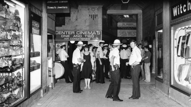 Police seal off the ground floor of the Manchester Unity building after three men were killed. 