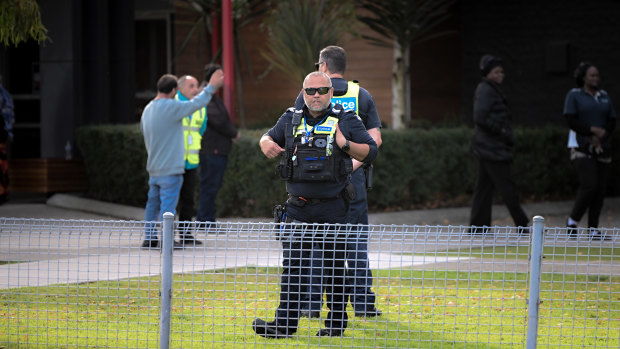 Security and police patrol outside Caroline Chisholm College in Braybrook after the fatal stabbing of Pasawm Lyhym at a Sunshine bus stop.