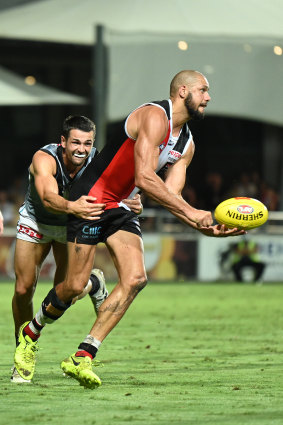 Paddy Ryder, right, handballs under pressure.