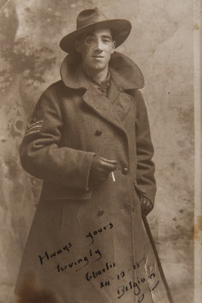 A portrait of Idris Charles Pike with monocle, cigarette and greatcoat.