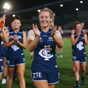 Arnell, Carlton’s inaugural women’s captain, leads the team off the field after beating Collingwood in the first ever AFLW match.