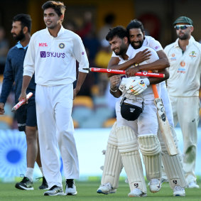 Rishabh Pant celebrates victory with his teammates.