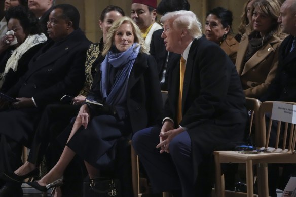 First lady Jill Biden talks to President-elect Donald Trump at the reopening of Notre-Dame Cathedral in Paris at the weekend.