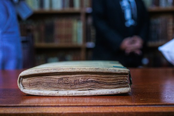 Words visible on the edge of the Malleus Maleficarum. 