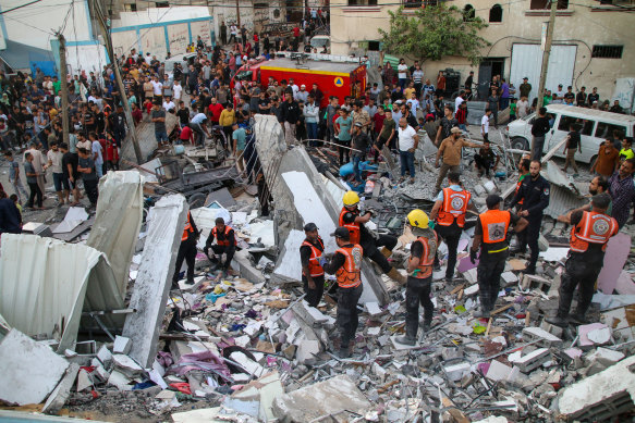 Civilians search for victims of an Israeli airstrike in Khan Yunis in Gaza.