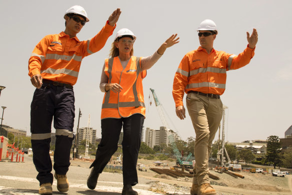 Kate Jones (centre) took over as Cross River Rail Minister last year. 