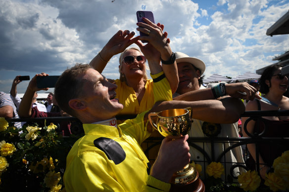 Melbourne Cup winning jockey Mark Zahra celebrates.