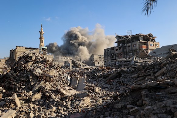 Smoke billows following an Israeli strike that targeted a building in the Bureij camp for Palestinian refugees in the central Gaza Strip on Sunday.