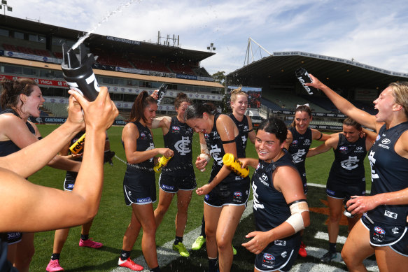 Carlton players celebrate after they defeated the Cats at Ikon Park on Sunday.