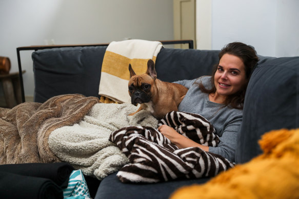 Ashley Williams surrounded by some of her blankets.