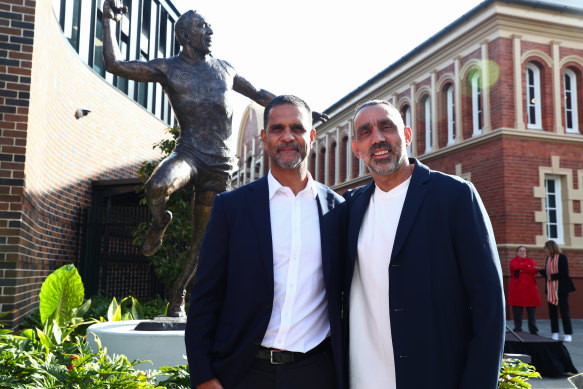 Swans greats Michael O’Loughlin and Adam Goodes unveil the Goodes statue near Swans headquarters last year.