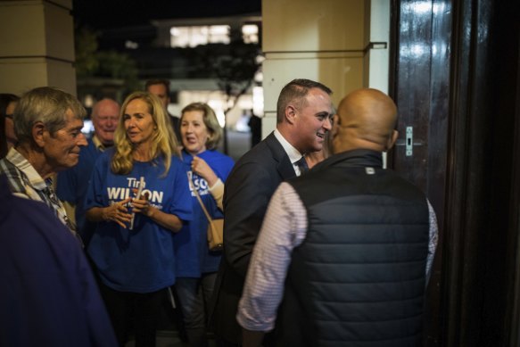 MP Tim Wilson arrives at the forum with his supporters.