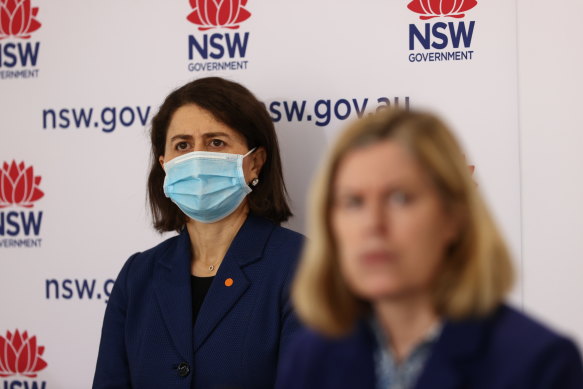 NSW Premier Gladys Berejiklian (background) and Chief Health Officer Dr Kerry Chant (foreground) on Tuesday.