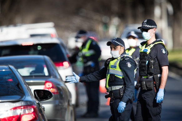 Police at a road block enforcing the  lockdown in Melbourne last week.