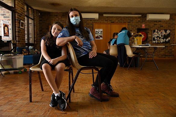 Lacey Dennis (left) with her mum Marybeth Sheen (right) from the Mt Druitt community at the Willmot vaccination hub.