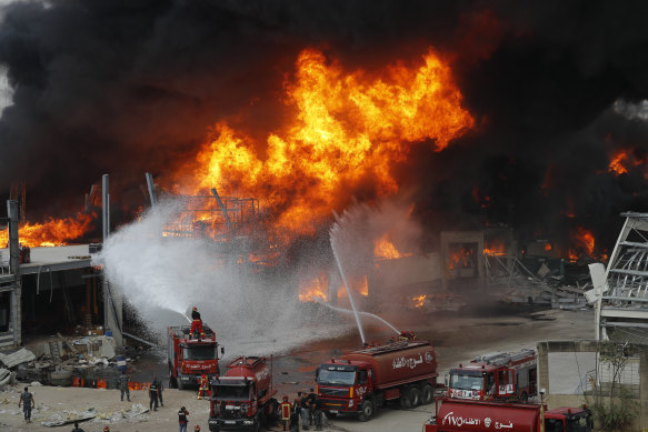 Firefighters battle to extinguish a huge blaze at the Port of Beirut on Thursday.