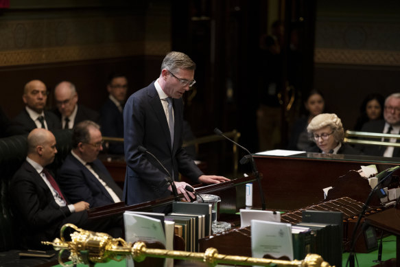 NSW Premier Dominic reading out the condolence motion. 