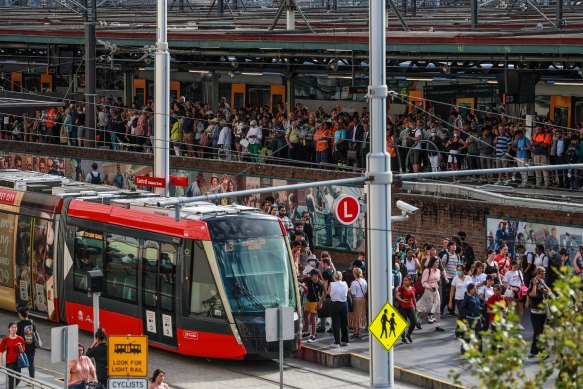 Commuters attempt to board Sydney’s light rail. 