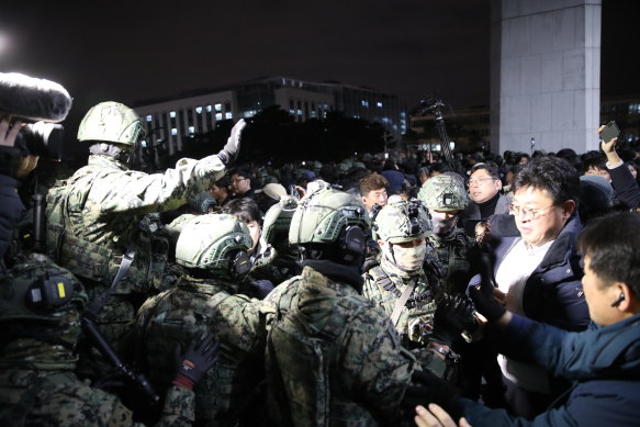 South Korean soldiers attempt to enter the national assembly in Seoul, South Korea, on December 4. 