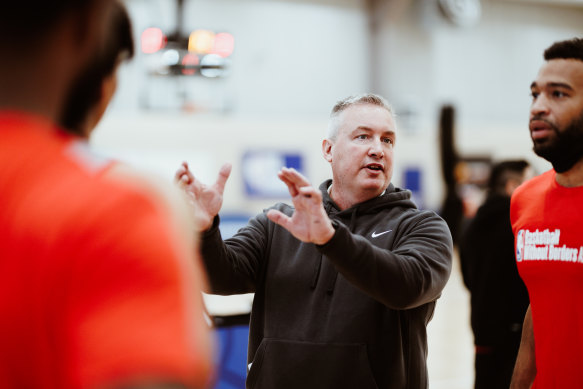 Chicago Bulls assistant coach Damian Cotter instructs players at the NBA Basketball Without Borders Asia camp.
