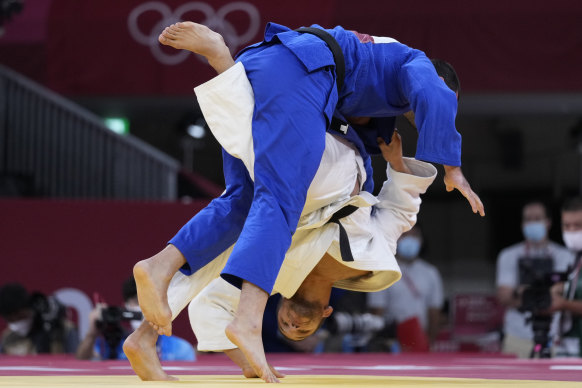Hungary’s Krisztian Toth and Mikhail Igolnikov of the Russian Olympic Committee do battle in Tokyo.