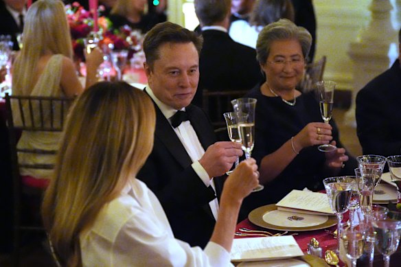Elon Musk toasts first lady Melania Trump.