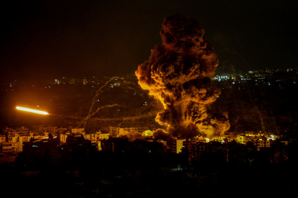 Heavy smoke and flames billow from Beirut’s southern suburb after an Israeli airstrike. 