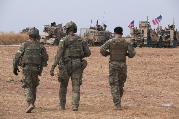 An American military convoy stops near the town of Tel Tamr, north Syria, on Sunday.