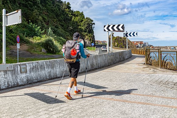 A Camino walker passes through the town of Getaria.