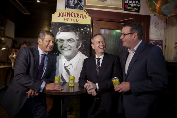 Former premier Steve Bracks, then-opposition leader Bill Shorten and Premier Daniel Andrews share a beer at The Curtin after Bob Hawke’s death in 2019.