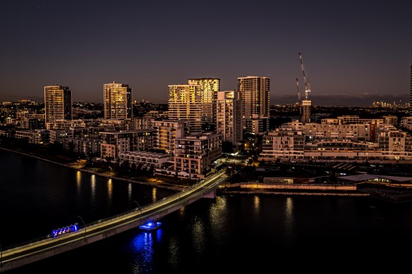 The government will reward councils that take on more development. Pictured is the riverside suburb of Rhodes at sunset.