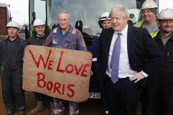 Workers pose with Boris Johnson in Middlesbrough, England.