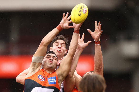GWS player Tim Taranto stretches for a mark against the Saints. 