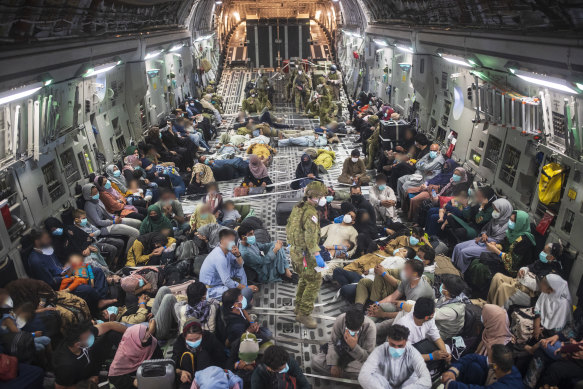 Australian citizens and visa holders  evacuate to the Australian Defence Force’s main Middle East operating base on a Royal Australian Air Force C-17A Globemaster III aircraft after leaving Afghanistan. 