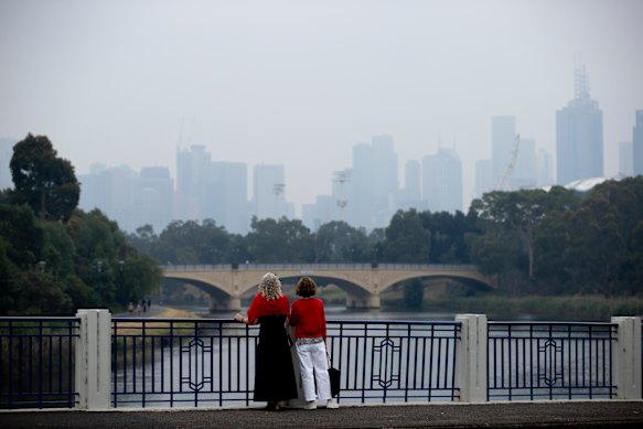 Smoke from fires can be seen in central Melbourne on Sunday. 