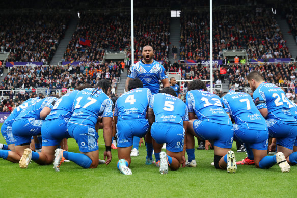 Junior Paulo leads Samoa’s Manu Siva Tau before their World Cup opener against England.