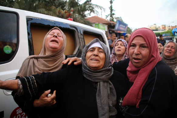 Family members mourn the death of a young Palestinian man in an airstrike in Khan Yunis in Gaza.