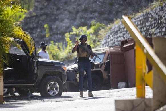 Guards patrol the entrance to the residence of Haiti’s President hours after his fatal shooting.