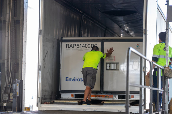 The first vials of the AstraZeneca COVID-19 vaccine arriving at Sydney Airport on Sunday morning.